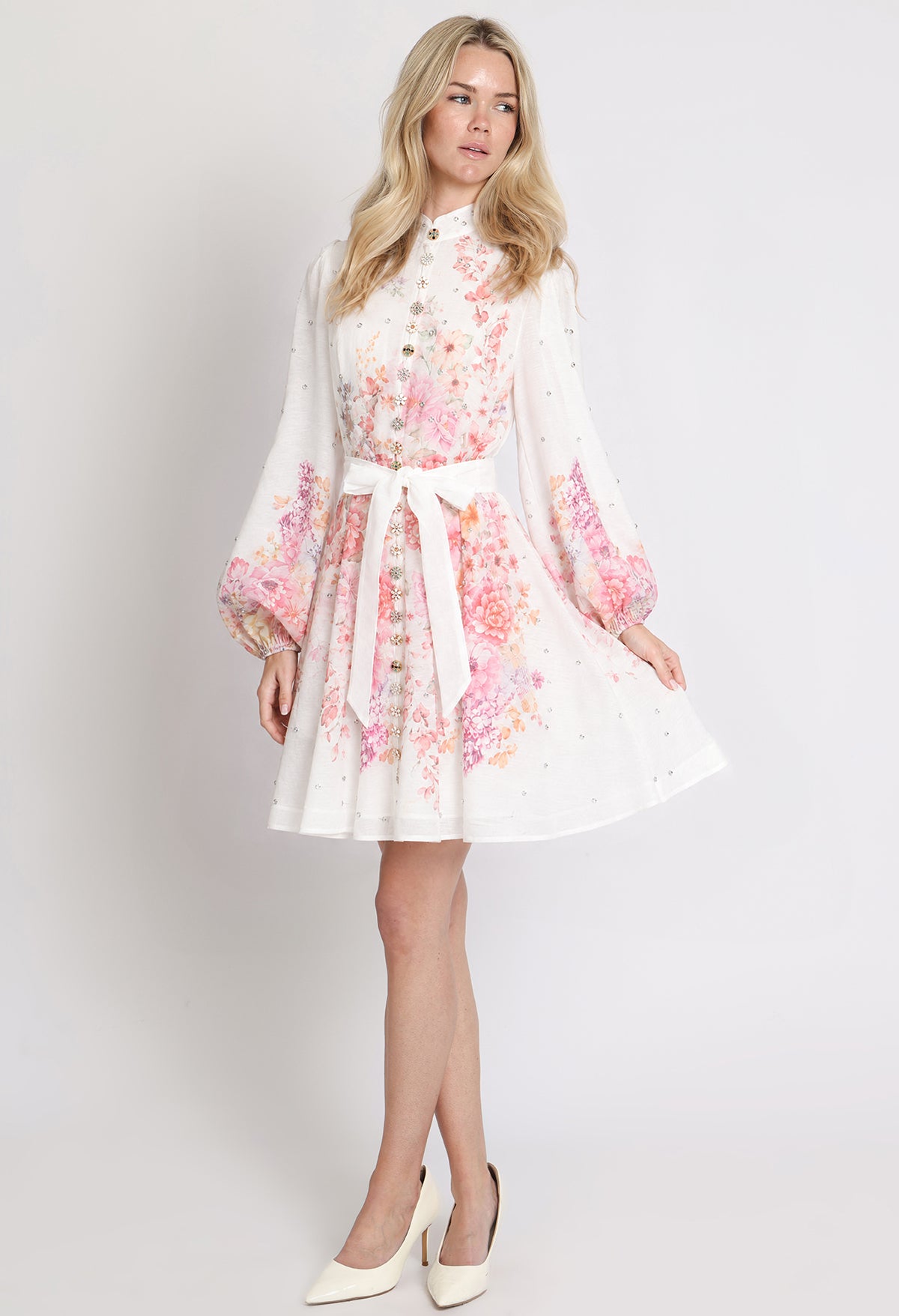 Woman wearing a floral dress on a white background