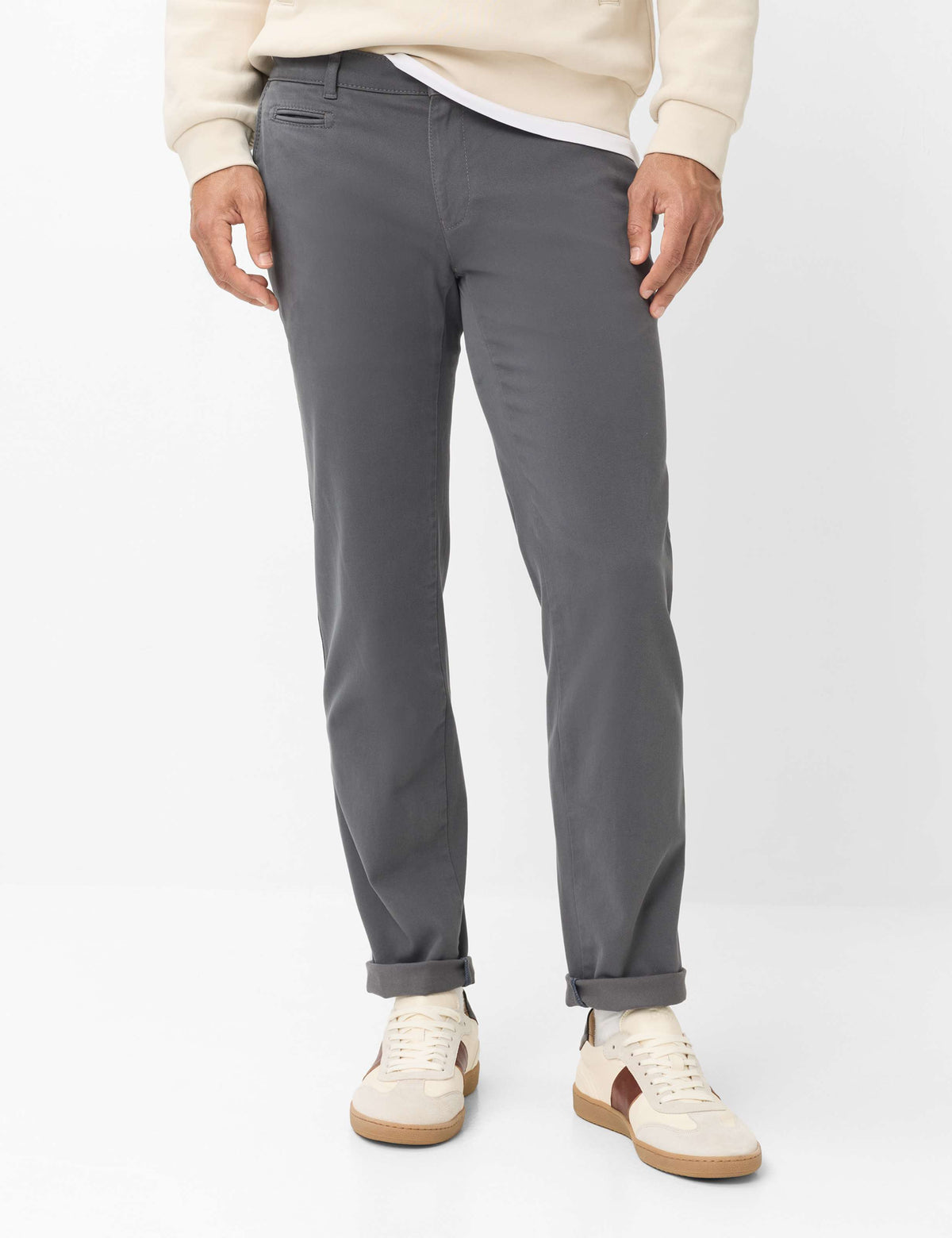 Slim-fit gray trousers.