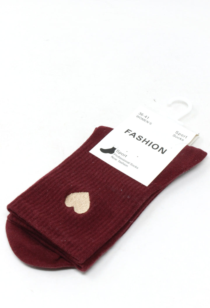 A pair of burgundy ribbed knit ankle socks with a small beige heart detail on the side, packaged on a white card with a plastic hanger against a white background.