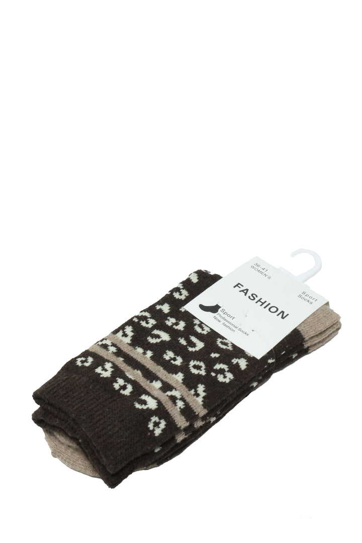 A pair of dark brown patterned socks with white and beige leopard-like spots and a horizontal beige stripe, packaged on a white hanger card labeled FASHION, on a white background.
