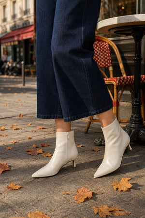 cream kitten heeled boots with a size zip