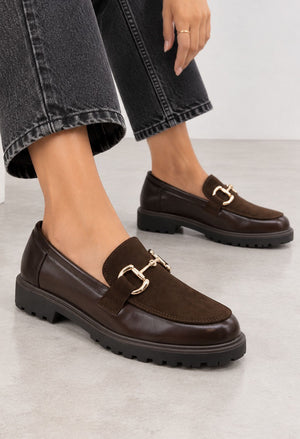 brown loafer with golden buckle