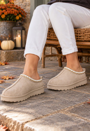 beige slip on boot with embroidered trim