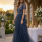 NAVY V NECK SEQUIN AND TULLE DRESS WITH TIE WAIST