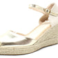 Gold wedge sandal with espadrille sole on a white background
