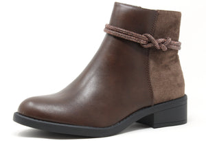 A brown ankle boot with a round toe, faux suede heel, and diamante twist detail. It features a block heel and a zip closure.
