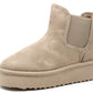a beige faux suede slip on Chelsea slip boot with platform sole on a white background