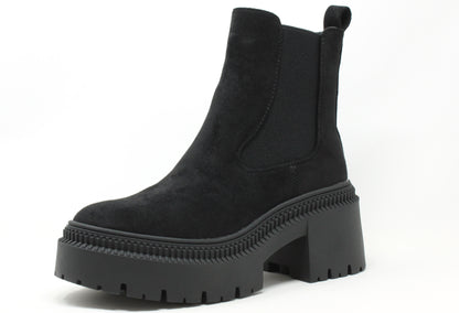 a chunky sole boot on a white background