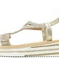 Gold sandal with platform sole on a white background