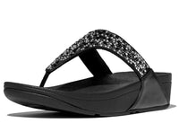 A black Fit Flop Lulu Stone Hot-Fix sandal with a studded strap and a micro-wobbleboard design.