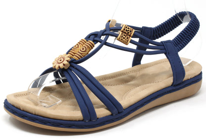 Blue sandal with wooden look beads on a white background