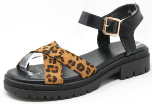Black sandal with a leopard print strap on a white background