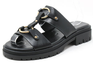 Black sandal with gold accents on a white background