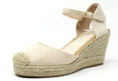 Beige wedge sandal with espadrille sole on a white background