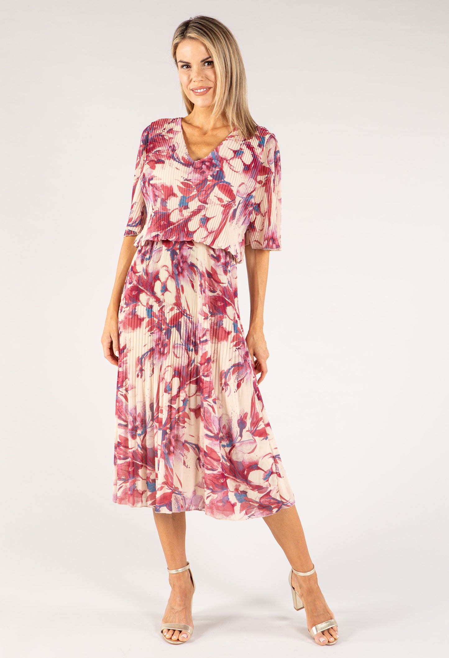 Woman wearing a floral dress on a white background