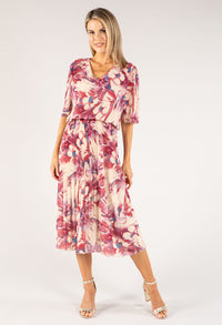 Woman wearing a floral dress on a white background