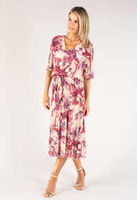 Woman wearing a floral dress on a white background