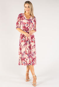 Woman wearing a floral dress on a white background