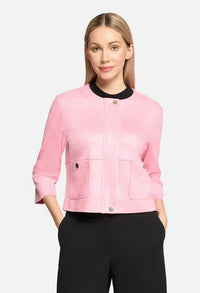 Woman wearing a pink jacket with a black collar on a white background