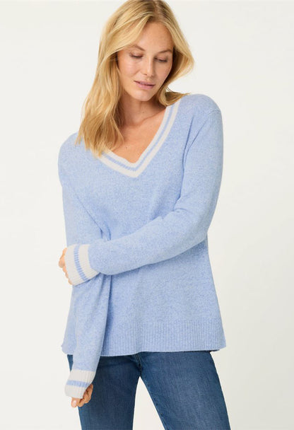 woman wearing a light blue knit jumper