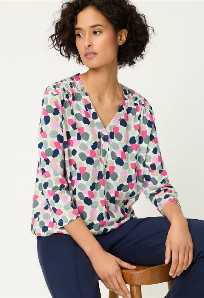 woman wearing a patterned top