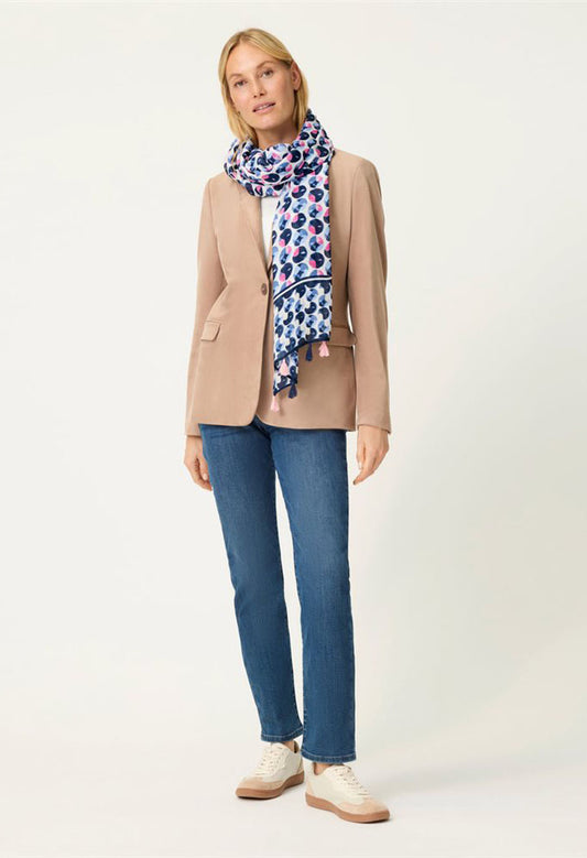 woman wearing a scarf with all over pink and blue print