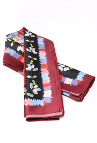 Folded scarf with colorful pattern on a white background