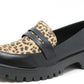 Loafer shoe with leopard print strap on a white background