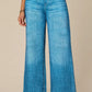 woman wearing wide leg blue jeans