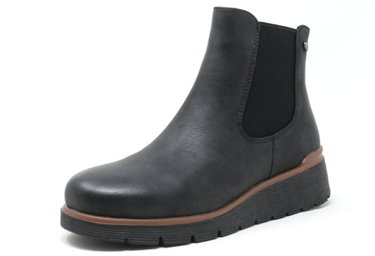 Black leather Chelsea boot with brown sole on a white background
