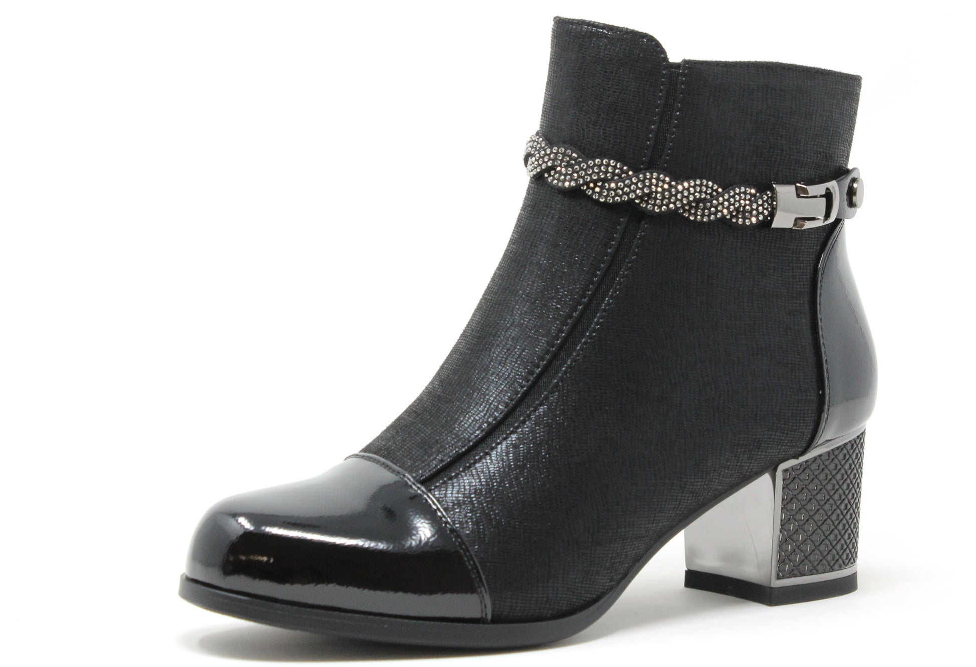 Black ankle boot with a decorative strap on a white background
