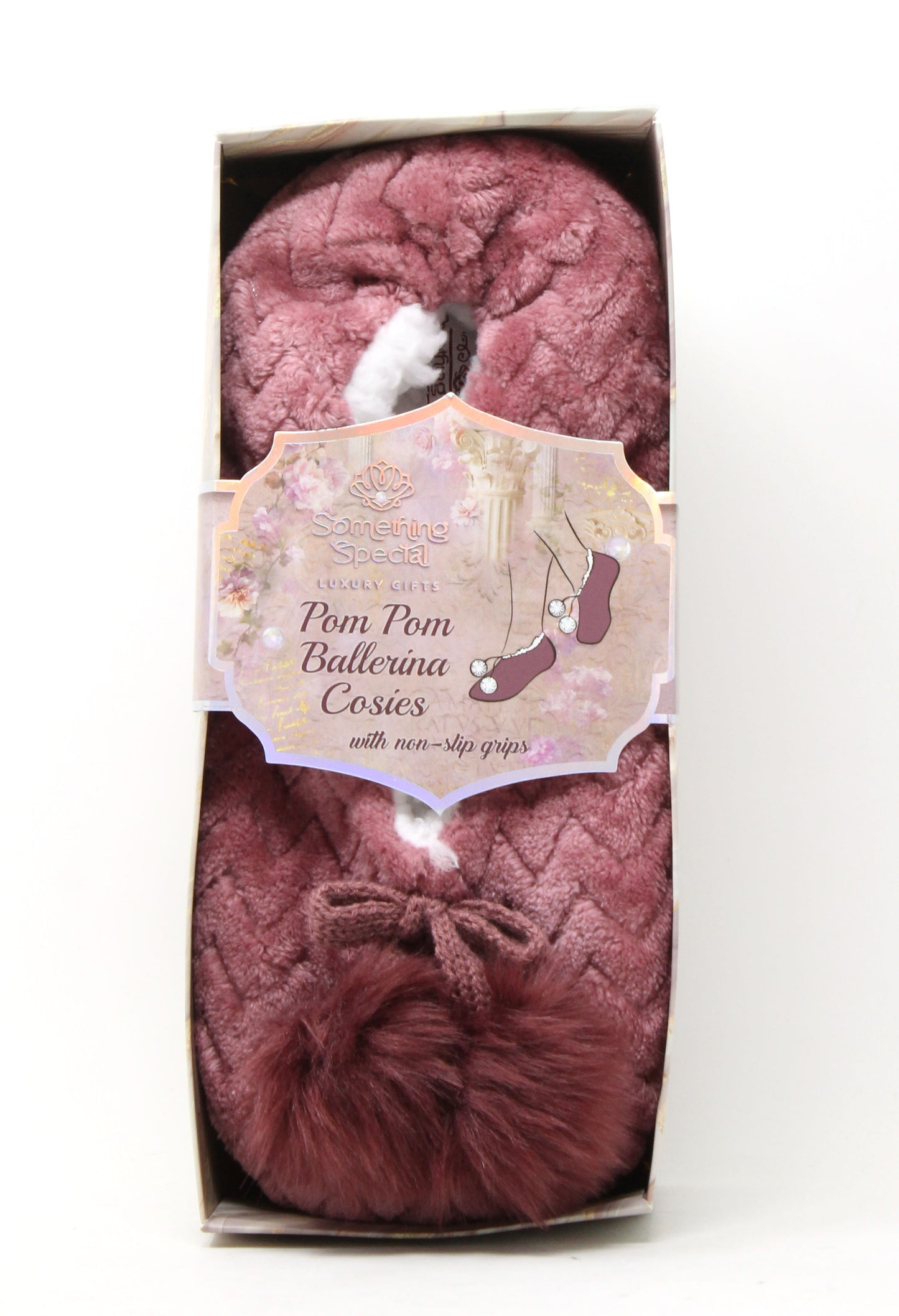 Pink pom-pom ballerina cosies in packaging with a label on a white background