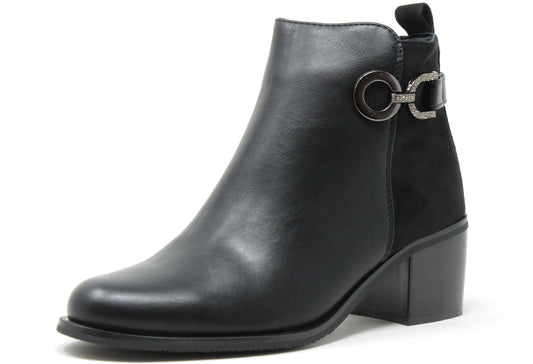 Black leather ankle boot with a decorative buckle on a white background