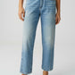 Person wearing light blue jeans on a white background