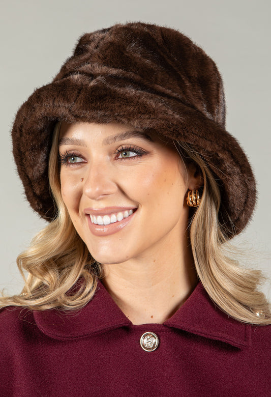 woman wearing a faux fur brown bucket hat