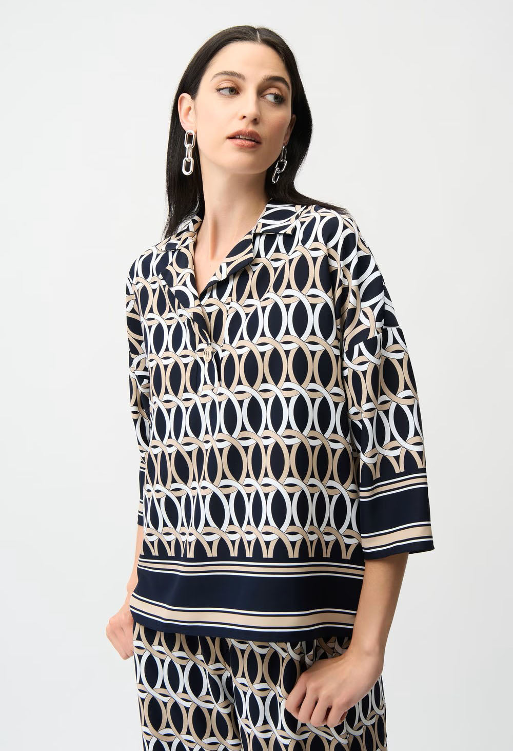 Woman wearing a patterned outfit on a white background