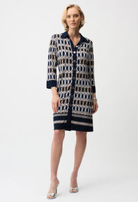 Woman wearing a patterned dress on a white background