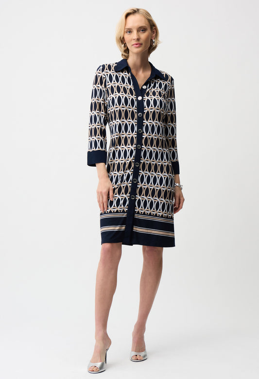 Woman wearing a patterned dress on a white background