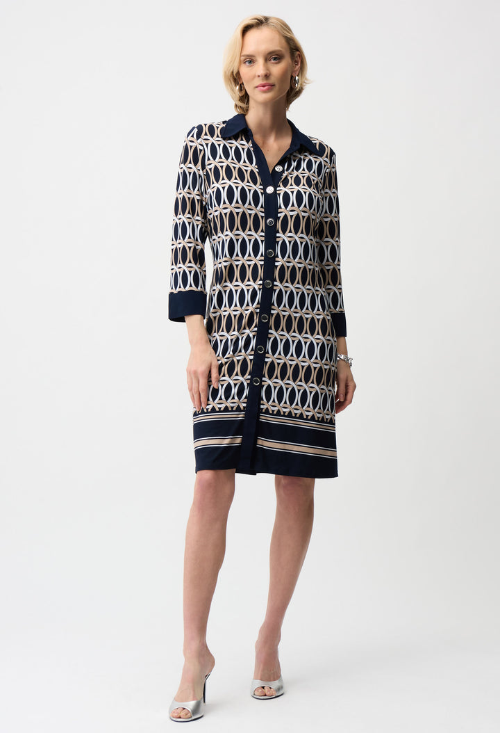 Woman wearing a patterned dress on a white background