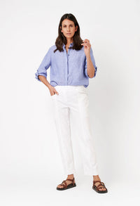 woman wearing white trousers