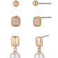 Set of gold and pearl earrings on a white background