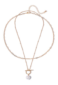Necklace with a pearl pendant on a white background