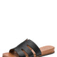 Black sandal with brown sole on a white background