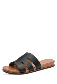 Black sandal with brown sole on a white background
