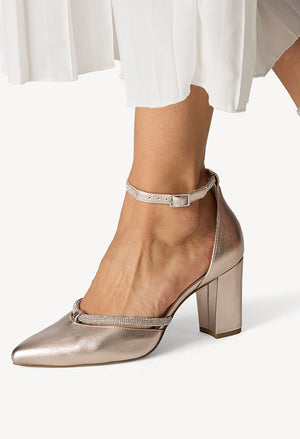 Metallic high-heeled shoe with a subtle pattern on a white background