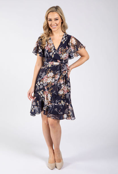 Woman wearing a floral dress on a white background