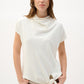 Woman wearing a white cowl-neck top with a tie detail on a white background