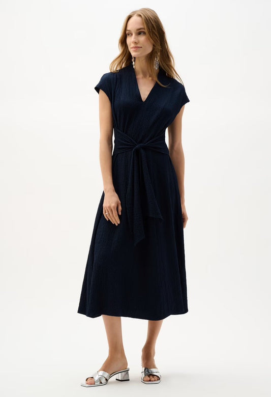 Woman wearing a black dress on a white background