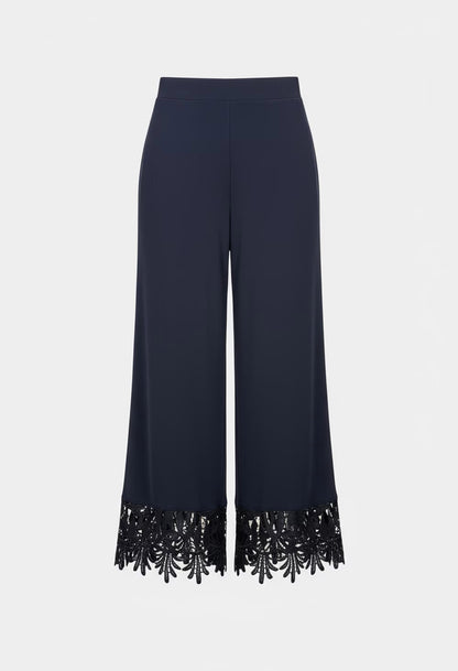 Navy blue pants with black sequin trim on a white background