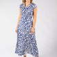 Woman wearing a blue floral dress on a white background